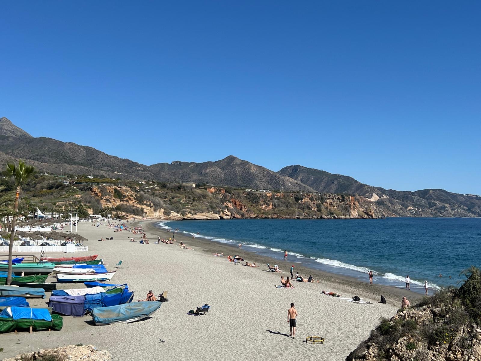 Burriana Beach with fishing boats and mountain backdrop