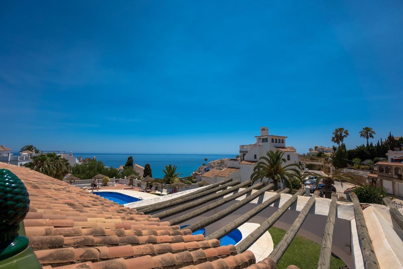 Rooftop view over the communal pool and Mediterranean sea