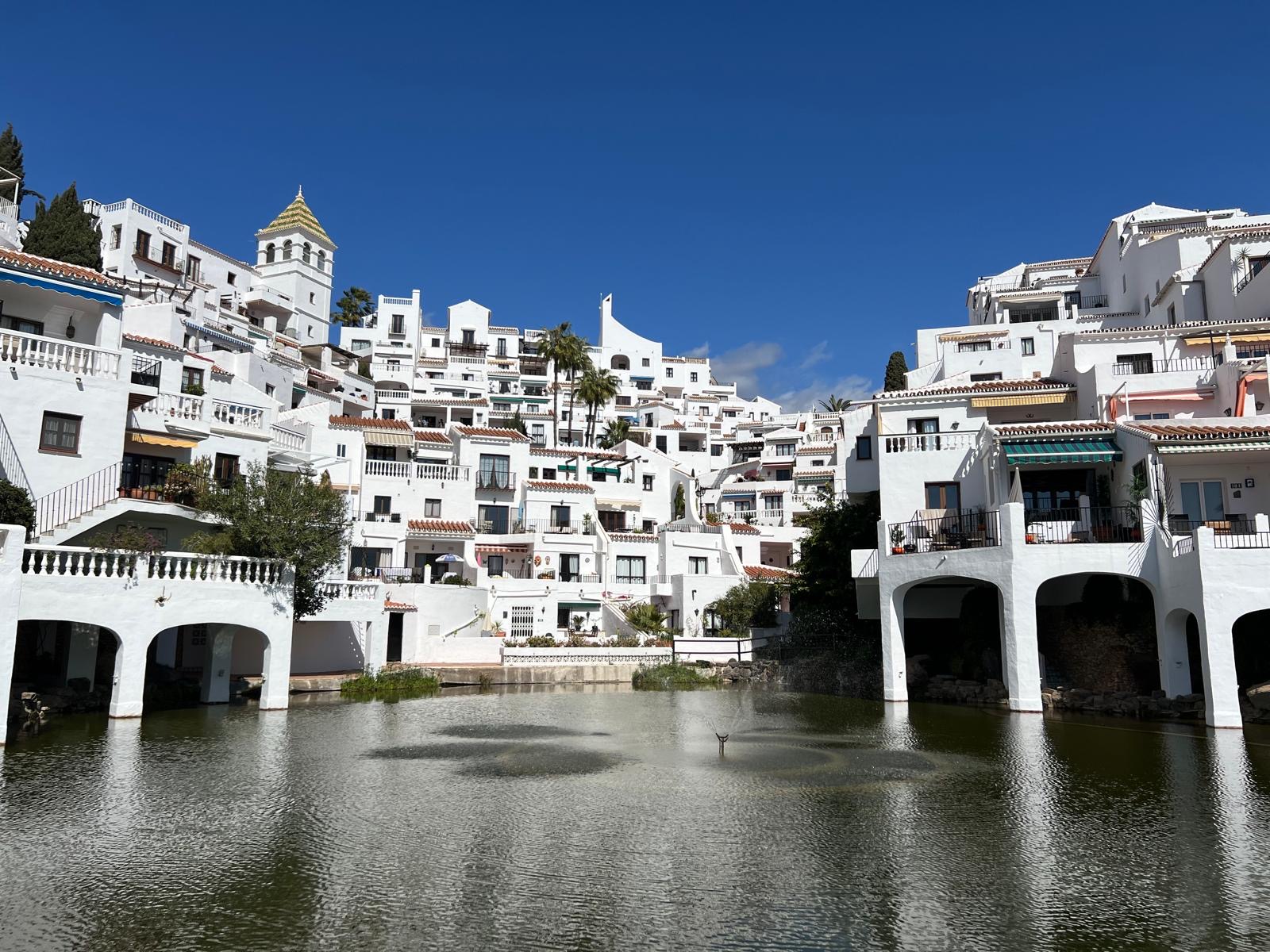 White Capistrano Playa buildings around the water feature